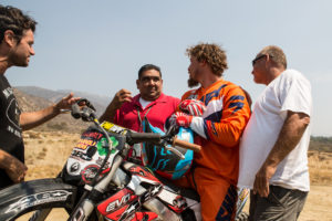 Brian McCarthy with his Dad, Producer Jay and the Tribal chief after he set two new World Records at Pala Raceway (CA) USA